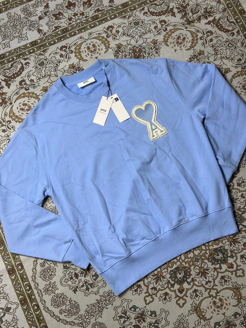 AMI Paris Heart Logo Sweatshirt Blue (Category: Coats, Jackets and Outerwear) located in Baao. Submitted by _garmentts (Listing ID 1429409612, Image 2). Description: Size: S-XL 100% Brand New With Plastic Bag Dm for more details📩 .
