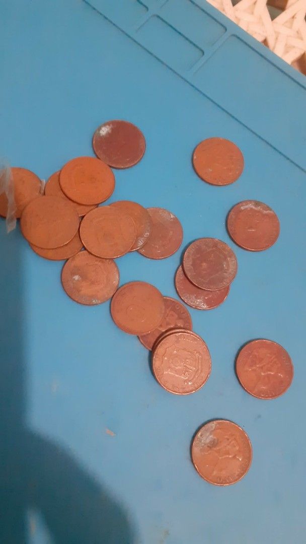 Assorted US Coins (Category: Currency) located in Lipa City. Submitted by newriver_a7c3ea (Listing ID 1429341047, Image 1). Description: Collection of assorted US coins. Includes copper pennies, nickel coins, and quarter coins. Great for collectors or those interested in US currency. Msg.na lang sa me need.