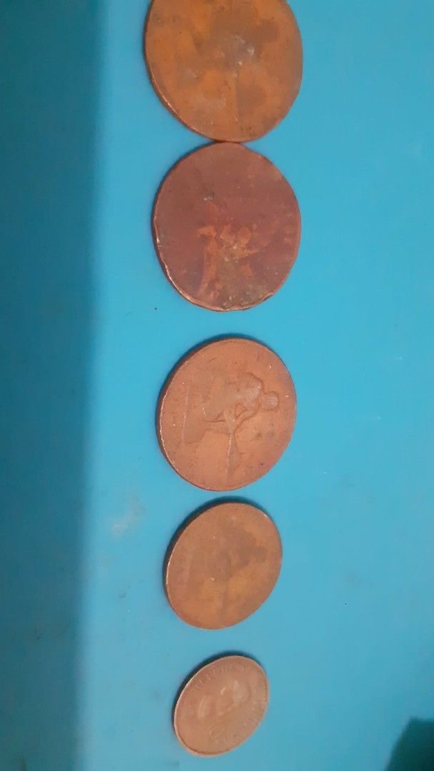 Assorted US Coins (Category: Currency) located in Lipa City. Submitted by newriver_a7c3ea (Listing ID 1429341047, Image 2). Description: Collection of assorted US coins. Includes copper pennies, nickel coins, and quarter coins. Great for collectors or those interested in US currency. Msg.na lang sa me need.