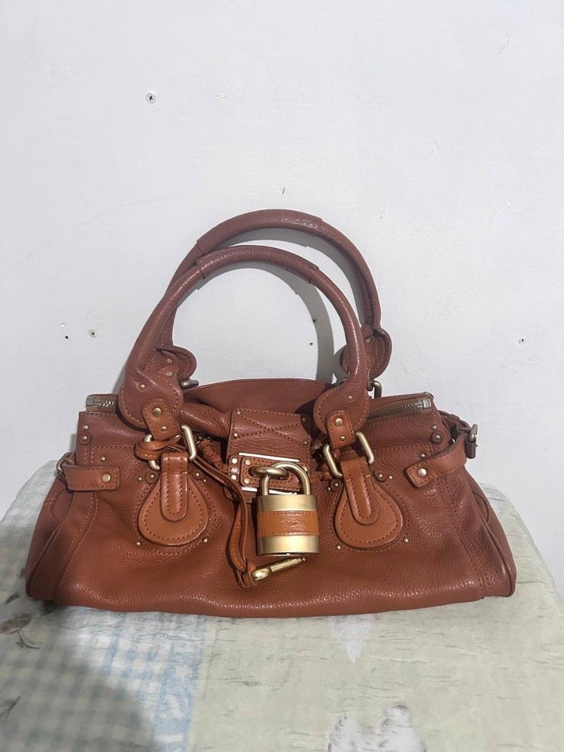 Authentic Classic Chloé Paddington in Medium dark brown (Category: Luxury Bags & Wallets) located in Quezon City. Submitted by rarefindsgirlie (Listing ID 1429259468, Image 2). Description: will only entertain interested buyer, pass to lowball. chloe paddington are hard to source in japan right now.🥲 MARKET PRICE FB/IG/CAROU/SITES: 50k-65k especially on ig (try to look lol) 🌟 guaranteed authentic 💫With COA (pdf&hard copy) 💤with generic dustba