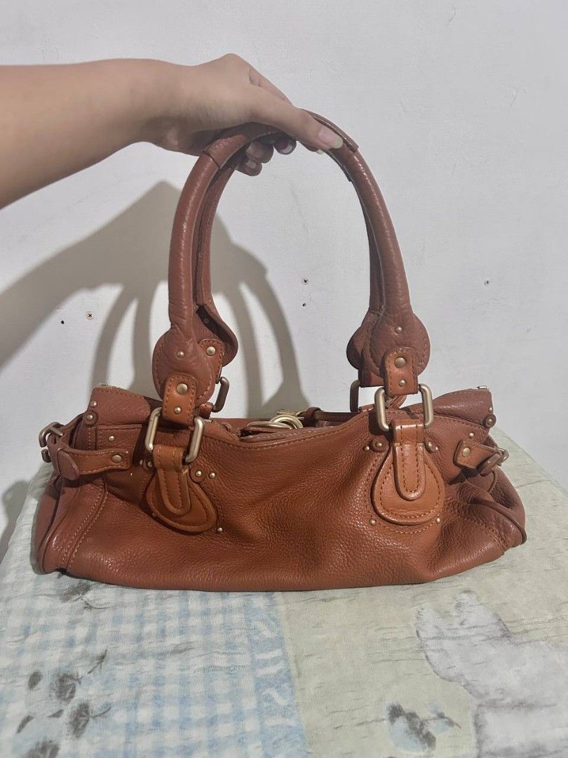 Authentic Classic Chloé Paddington in Medium dark brown (Category: Luxury Bags & Wallets) located in Quezon City. Submitted by rarefindsgirlie (Listing ID 1429259468, Image 3). Description: will only entertain interested buyer, pass to lowball. chloe paddington are hard to source in japan right now.🥲 MARKET PRICE FB/IG/CAROU/SITES: 50k-65k especially on ig (try to look lol) 🌟 guaranteed authentic 💫With COA (pdf&hard copy) 💤with generic dustba
