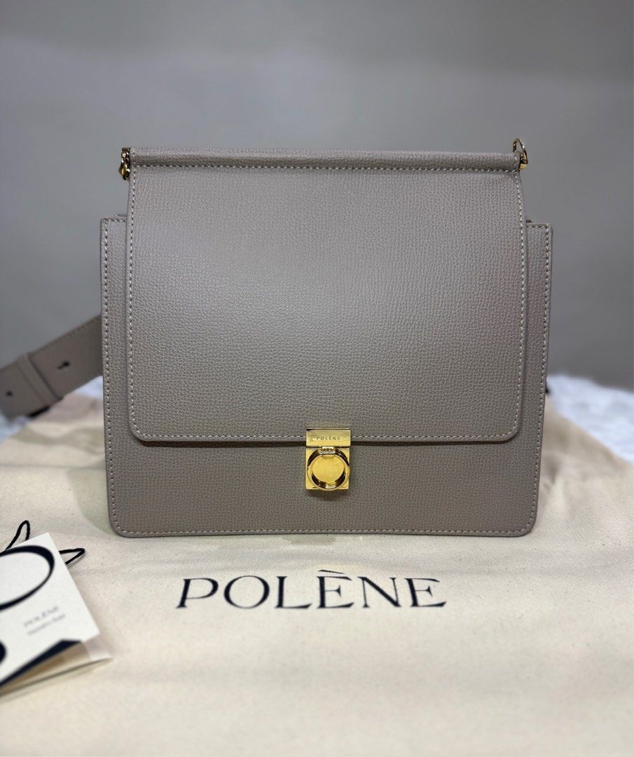 Authentic Like New Polène Numéro Sept Handbag (Category: Luxury Bags & Wallets) located in Quezon City. Submitted by inmycloset03 (Listing ID 1429459742, Image 2). Description: Polène Numéro Sept handbag in a neutral taupe color. Features a structured design with a flap closure and gold-tone hardware. Includes a detachable shoulder strap. The interior has a suede lining and a slip pocket. Comes with a dust bag and tag. Inclusion: orig dustbag, ca