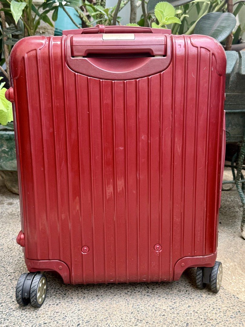 Authentic RIMOWA SALSA DELUXE Cabin (Category: Luggage) located in Manila. Submitted by urbantrendsetter (Listing ID 1429385113, Image 3). Description: Srp Php 48,xxx.00 This is an authentic RIMOWA Polycarbonate Salsa Deluxe Cabin in Orient Red. This chic Rimowa luggage is crafted from lightweight polycarbonate in gloss red. It features two carrying handles, a telescopic handle, and opens with acombo lock to a monogrammed fabric interior with two