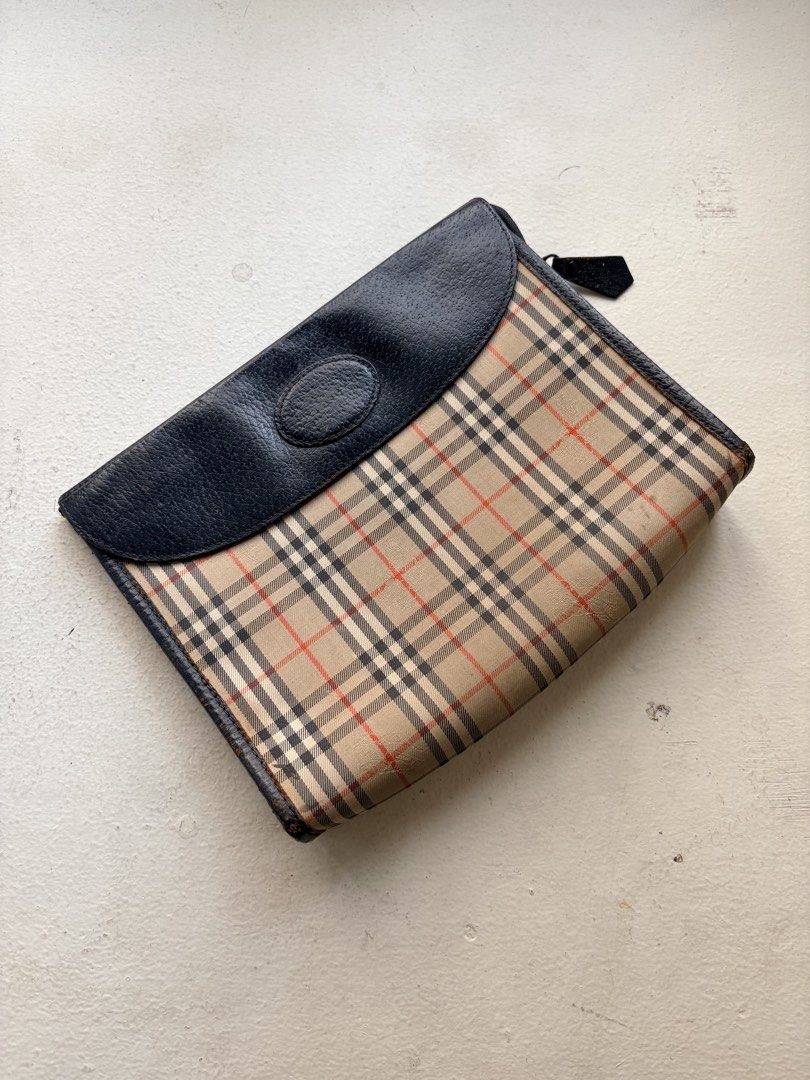 Authentic Vintage Iconic Burberry Clutch Bag (Category: Luxury Bags & Wallets) located in Mandaluyong City. Submitted by material_boi (Listing ID 1429356095, Image 1). Description: Vintage (meaning old) Burberry bought in Japan. In iconic nova check with the horse details. Canvas/fabric outer and full leather inside. Approx 9 inches wide and 7 inches long — can fit small wallet. 2 compartments: 1 sa flap and 1 main. Super nice condition consideri