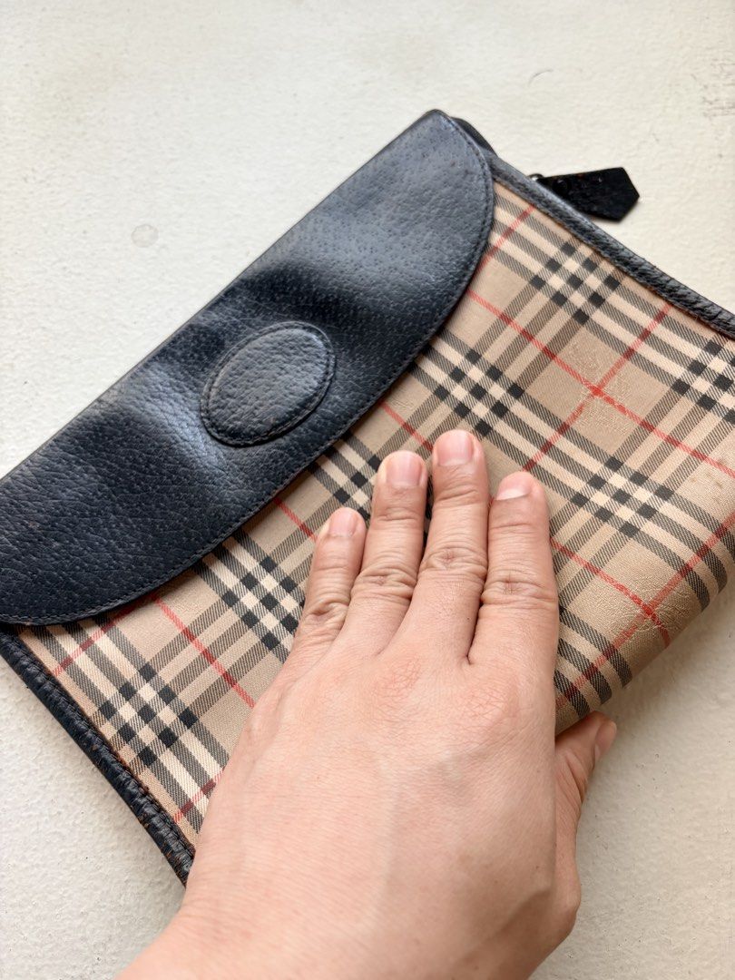 Authentic Vintage Iconic Burberry Clutch Bag (Category: Luxury Bags & Wallets) located in Mandaluyong City. Submitted by material_boi (Listing ID 1429356095, Image 2). Description: Vintage (meaning old) Burberry bought in Japan. In iconic nova check with the horse details. Canvas/fabric outer and full leather inside. Approx 9 inches wide and 7 inches long — can fit small wallet. 2 compartments: 1 sa flap and 1 main. Super nice condition consideri