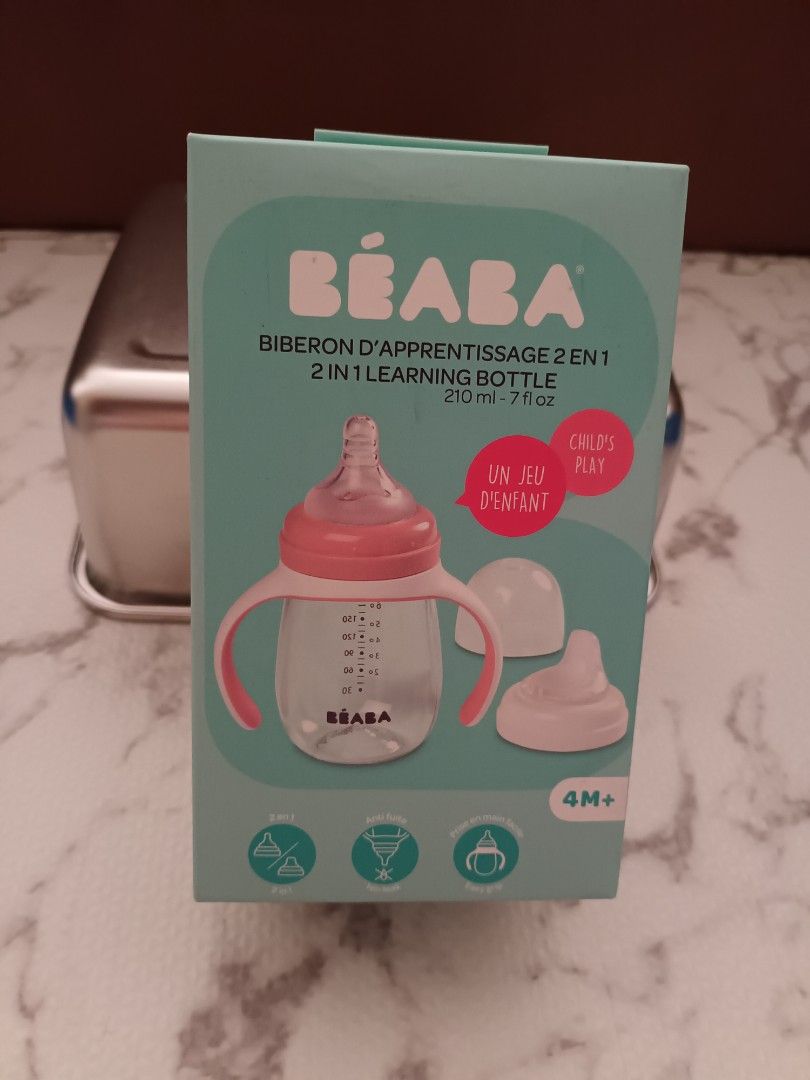 Beaba 2-in-1 Learning Bottle 210ml (Category: Breastfeeding & Bottle Feeding) located in Mandaluyong City. Submitted by faye5678 (Listing ID 1429415928, Image 1). Description: For Sale: Beaba 2-in-1 learning bottle, 210ml RFS: decluttering, did not end up using Brand New, Sealed SRP: P1,100 Selling at P700 only Includes a bottle with handles and a separate spout. Suitable for babies 4 months and up. The box indicates it is a 2-in-1 design. The bo
