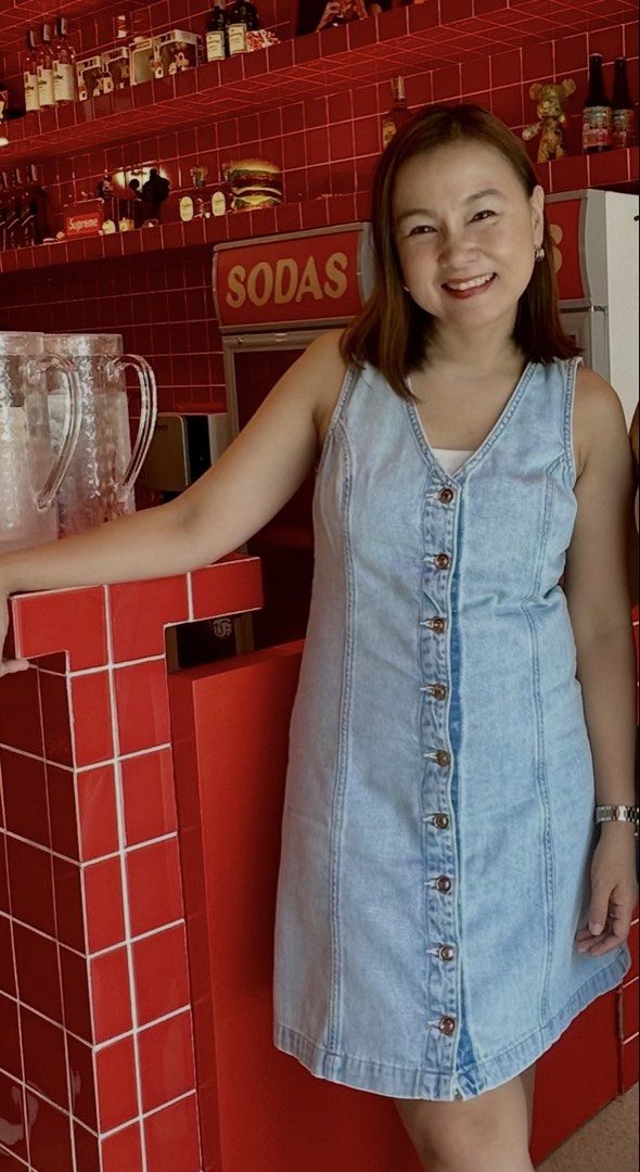 Bershka Denim Dress (Category: Dresses) located in Las Pinas. Submitted by nothingover300 (Listing ID 1429405594, Image 2). Description: Bershka denim dress with a V-neckline and button-down front. Features a sleeveless design and a light blue wash. The dress is made in Bangladesh. The size is EUR 38, USA 06, MEX 28. Perfect for casual wear. Used only once.