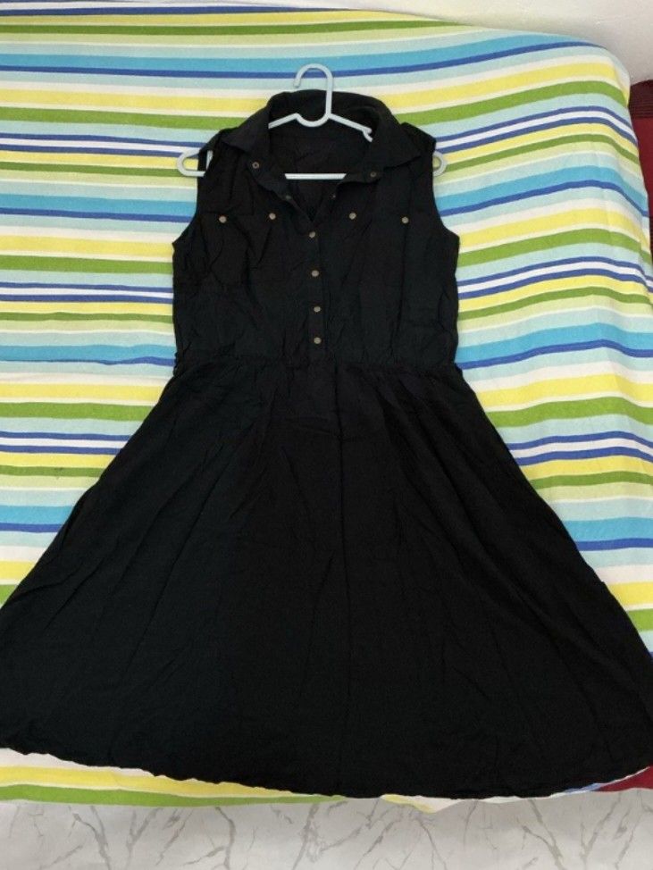 Black Sleeveless Dress (Category: Dresses) located in San Fernando. Submitted by elixiriaz (Listing ID 1429496622, Image 1). Description: Black sleeveless dress with a collared neckline and button-down front. It has a fitted waist and a flared skirt. It has a simple, classic design suitable for various occasions..