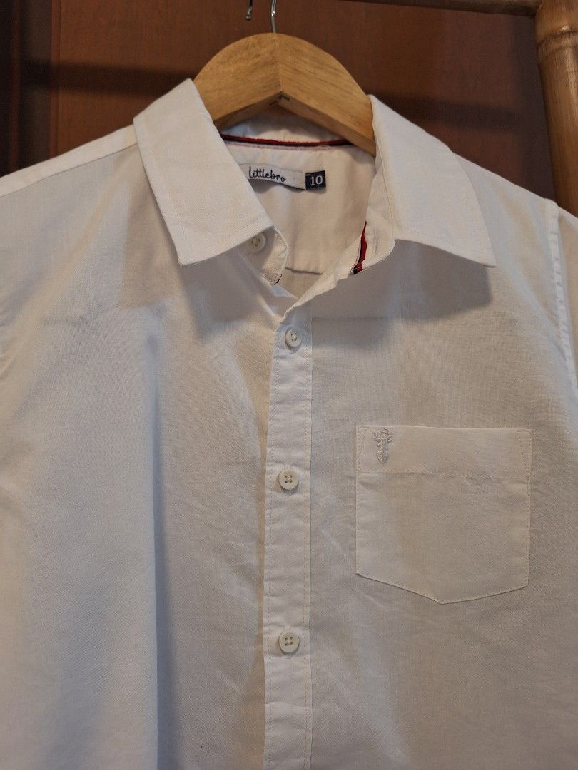Boys White Button-Down Shirt Long Sleeves (Category: Babies & Kids Fashion) located in Antipolo. Submitted by flutterby41319 (Listing ID 1429372378, Image 2). Description: never been worn, just laundered and pressed long sleeves white polo for boys 8-9 years old. chest 16.5" L 22" sleeves 18".