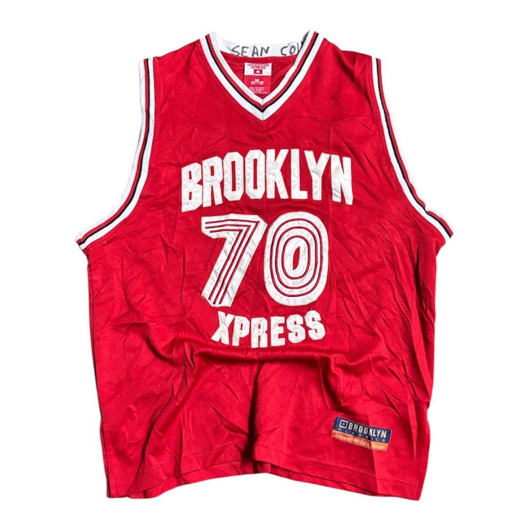 Brooklyn Xpress Basketball Jersey (Category: Activewear) located in Manila. Submitted by iro_ir0 (Listing ID 1429422896, Image 1). Description: Vintage Brooklyn Express Jersey — ( Very Hard to Find Condition ) 🏷️ + sf Width : 20.5 Length : 26.5 Issue : NONE ( Good Condition ) - Red Brooklyn Xpress basketball jersey - Features "BROOKLYN" on the front and "70" on the front and back - White and black trim - Size: M (10-12) - Material: 100% polyeste