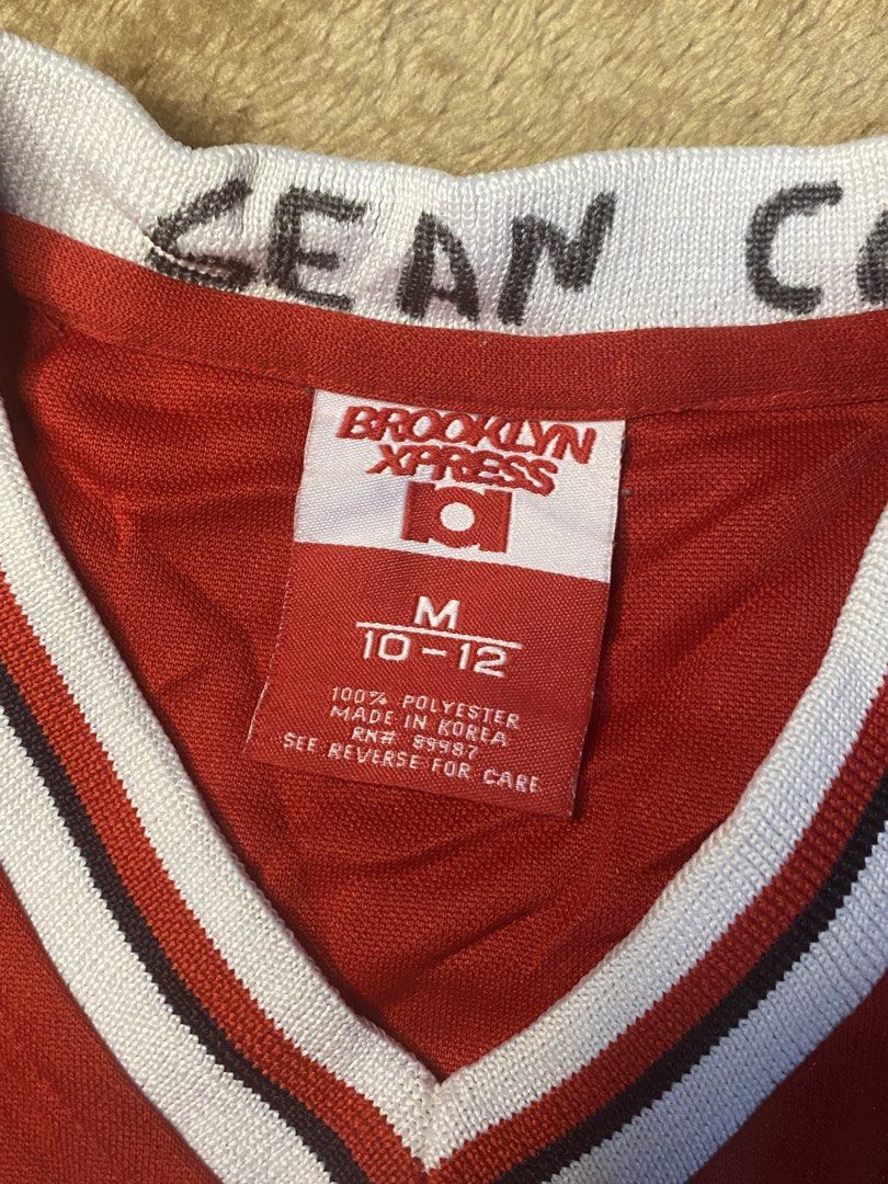 Brooklyn Xpress Basketball Jersey (Category: Activewear) located in Manila. Submitted by iro_ir0 (Listing ID 1429422896, Image 3). Description: Vintage Brooklyn Express Jersey — ( Very Hard to Find Condition ) 🏷️ + sf Width : 20.5 Length : 26.5 Issue : NONE ( Good Condition ) - Red Brooklyn Xpress basketball jersey - Features "BROOKLYN" on the front and "70" on the front and back - White and black trim - Size: M (10-12) - Material: 100% polyeste