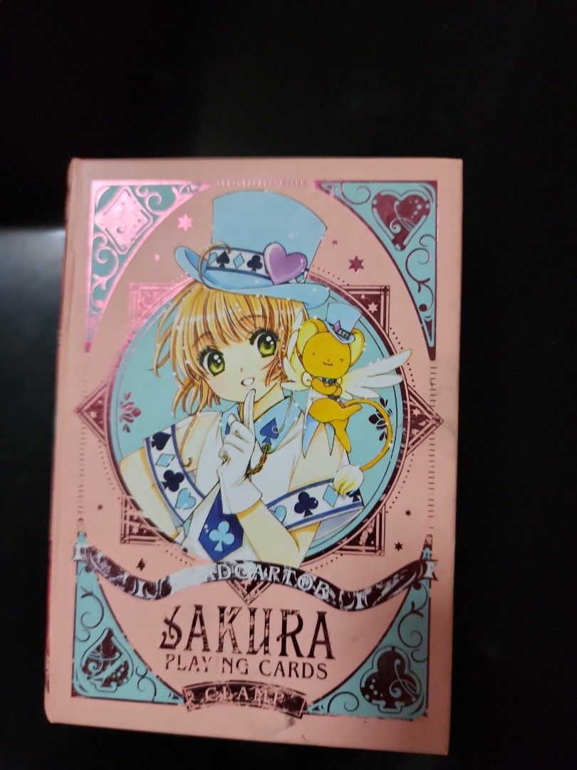 Cardcaptor Sakura Playing Cards (Category: Board Games & Puzzles) located in Caloocan City. Submitted by mykee125 (Listing ID 1429424903, Image 1). Description: Cardcaptor Sakura playing cards featuring the iconic anime characters. The deck comes in a pink box with matching designs. The cards themselves feature vibrant artwork and are still sealed in plastic. The box also has a decorative interior..