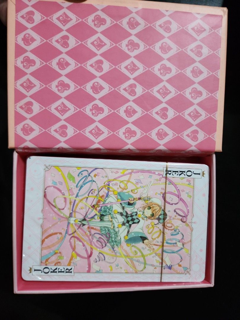 Cardcaptor Sakura Playing Cards (Category: Board Games & Puzzles) located in Caloocan City. Submitted by mykee125 (Listing ID 1429424903, Image 3). Description: Cardcaptor Sakura playing cards featuring the iconic anime characters. The deck comes in a pink box with matching designs. The cards themselves feature vibrant artwork and are still sealed in plastic. The box also has a decorative interior..