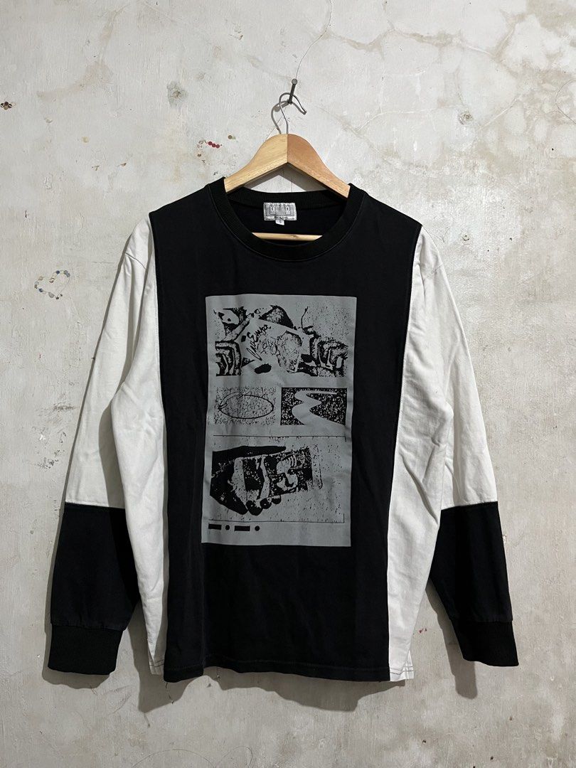 Cav Empt Graphic Long Sleeve Shirt (Category: Tshirts & Polo Shirts ) located in Santa Cruz. Submitted by thriftgane0.2 (Listing ID 1429459987, Image 1). Description: Cav Empt long sleeve shirt with a graphic print on the front. Features a black and white color block design. The brand name is printed on the back. Made in Japan. Size S..