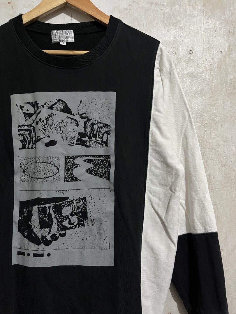 Cav Empt Graphic Long Sleeve Shirt (Category: Tshirts & Polo Shirts ) located in Santa Cruz. Submitted by thriftgane0.2 (Listing ID 1429459987, Image 3). Description: Cav Empt long sleeve shirt with a graphic print on the front. Features a black and white color block design. The brand name is printed on the back. Made in Japan. Size S..