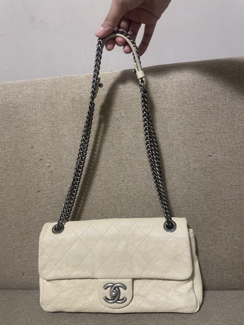 Chanel classic flap (Category: Luxury Bags & Wallets) located in General Trias. Submitted by cris4 (Listing ID 1429462279, Image 2). Description: Chanel classic medium flap Beige/off white color Series 15 Caviar leather Gun metal HW With dustbag and entrupy Clean interior Minor dirt on the corners.