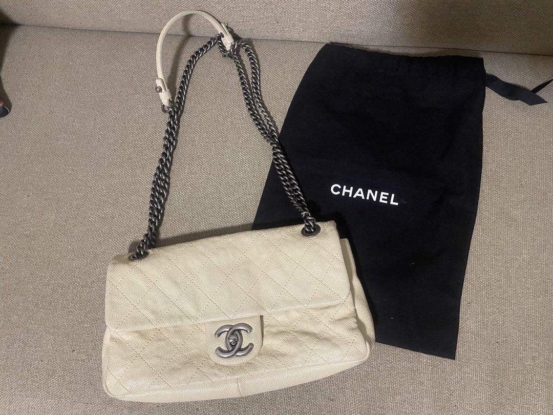 Chanel classic flap (Category: Luxury Bags & Wallets) located in General Trias. Submitted by cris4 (Listing ID 1429462279, Image 1). Description: Chanel classic medium flap Beige/off white color Series 15 Caviar leather Gun metal HW With dustbag and entrupy Clean interior Minor dirt on the corners.