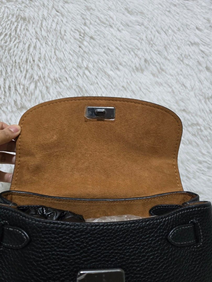 Coach Emory Black Crossbody Bag (Category: Luxury Bags & Wallets) located in Baguio. Submitted by obsessed_ph (Listing ID 1429367057, Image 3). Description: 🖤 BRANDNEW & SEALED Coach Emory Top Handle 🖤 💯 Authentic/Original Hardware condition: 10/10 Leather condition: 10/10 Material: Pebbled Leather Hardware: Gunmetal Dimensions (LxWxH): Inclusions: Adjustable sling strap Care card Tag price Retails for $498 Price: 8,490 (SUPER DEAL PRICE) For 