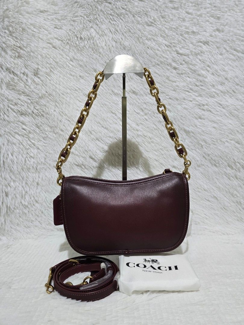 Coach Swinger Shoulder/Crossbody Bag- Regular Size (Category: Luxury Bags & Wallets) located in Baguio. Submitted by obsessed_ph (Listing ID 1429388055, Image 2). Description: 🍷 BRANDNEW Coach Swinger in Merlot - Regular Size 🍷 💯 Authentic/Original Hardware condition: 10/10 Leather condition: 10/10 Material: Original Glovetanned Leather Size: Regular (bigger than swinger 20) Dimensions (LxWxH): Zipper closure With original dustbag and care car