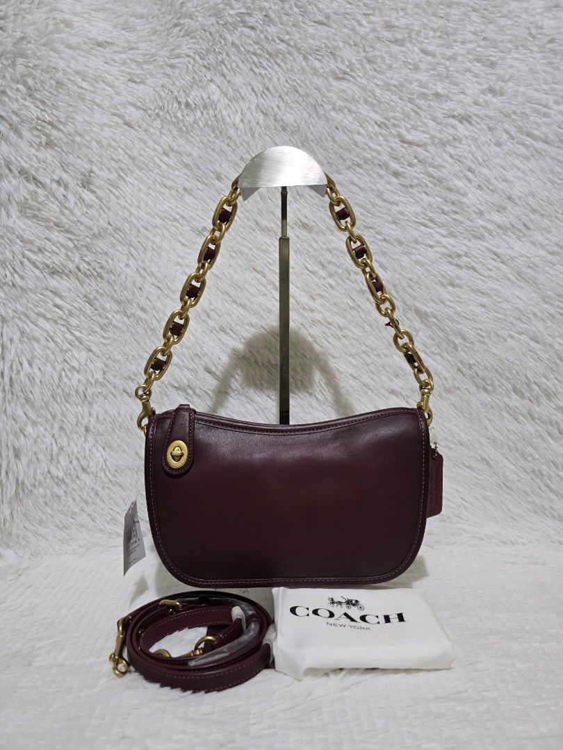 Coach Swinger Shoulder/Crossbody Bag- Regular Size (Category: Luxury Bags & Wallets) located in Baguio. Submitted by obsessed_ph (Listing ID 1429388055, Image 1). Description: 🍷 BRANDNEW Coach Swinger in Merlot - Regular Size 🍷 💯 Authentic/Original Hardware condition: 10/10 Leather condition: 10/10 Material: Original Glovetanned Leather Size: Regular (bigger than swinger 20) Dimensions (LxWxH): Zipper closure With original dustbag and care car