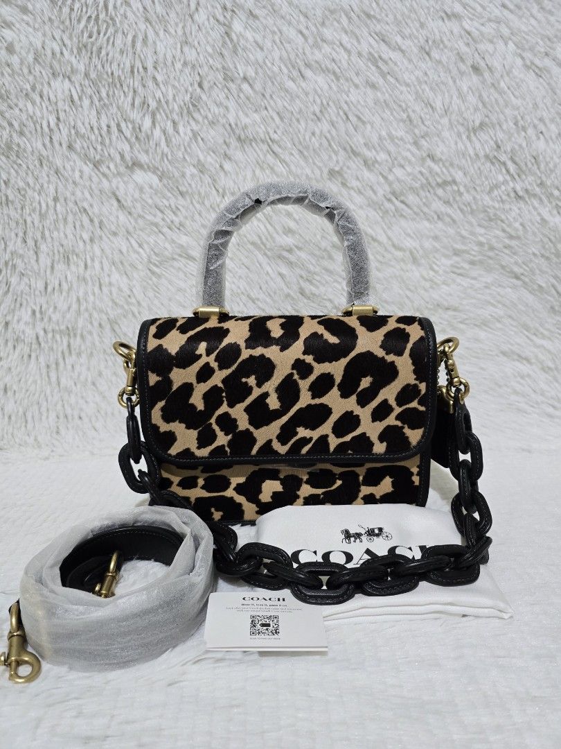 Coach Top Handle Rogue - Leopard Print Crossbody/Shoulder Bag (Category: Luxury Bags & Wallets) located in Baguio. Submitted by obsessed_ph (Listing ID 1429367296, Image 1). Description: ✨️ BRANDNEW & SEALED Coach Rogue Top Handle ✨️ 💯 Authentic/Original Hardware condition: 10/10 Leather condition: 9/10 (press mark at the bottom, few scratches, see indicated issue at the photos) Dimensions (LxWxH): 1 big compartment 3 slim compartments Inclusion