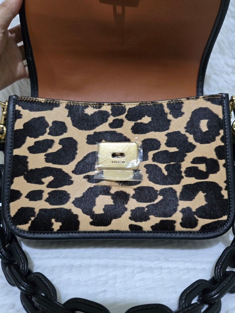 Coach Top Handle Rogue - Leopard Print Crossbody/Shoulder Bag (Category: Luxury Bags & Wallets) located in Baguio. Submitted by obsessed_ph (Listing ID 1429367296, Image 2). Description: ✨️ BRANDNEW & SEALED Coach Rogue Top Handle ✨️ 💯 Authentic/Original Hardware condition: 10/10 Leather condition: 9/10 (press mark at the bottom, few scratches, see indicated issue at the photos) Dimensions (LxWxH): 1 big compartment 3 slim compartments Inclusion