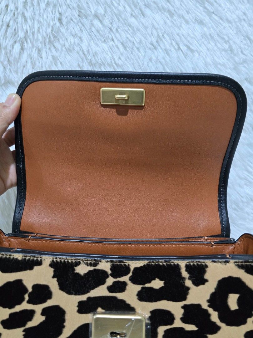 Coach Top Handle Rogue - Leopard Print Crossbody/Shoulder Bag (Category: Luxury Bags & Wallets) located in Baguio. Submitted by obsessed_ph (Listing ID 1429367296, Image 3). Description: ✨️ BRANDNEW & SEALED Coach Rogue Top Handle ✨️ 💯 Authentic/Original Hardware condition: 10/10 Leather condition: 9/10 (press mark at the bottom, few scratches, see indicated issue at the photos) Dimensions (LxWxH): 1 big compartment 3 slim compartments Inclusion