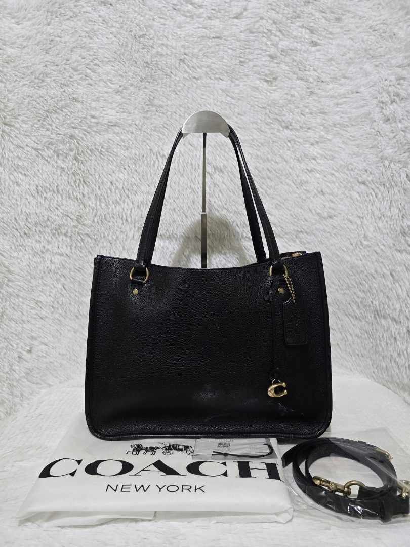 Coach Tyler Carryall - Tote Bag (Category: Luxury Bags & Wallets) located in Baguio. Submitted by obsessed_ph (Listing ID 1429366061, Image 1). Description: ♟️PRELOVED Coach Tyler Carryall♟️ 💯 Authentic/Original Hardware condition: 9.9/10 (almost unnoticeable scratch sa feet) Leather condition: 9.9/10 Material: Pebbled Leather Hardware: Brass Gold Dimensions (LxWxH): 2 open compartments 1 middle zipper compartment Inclusions: Adjustable sling st