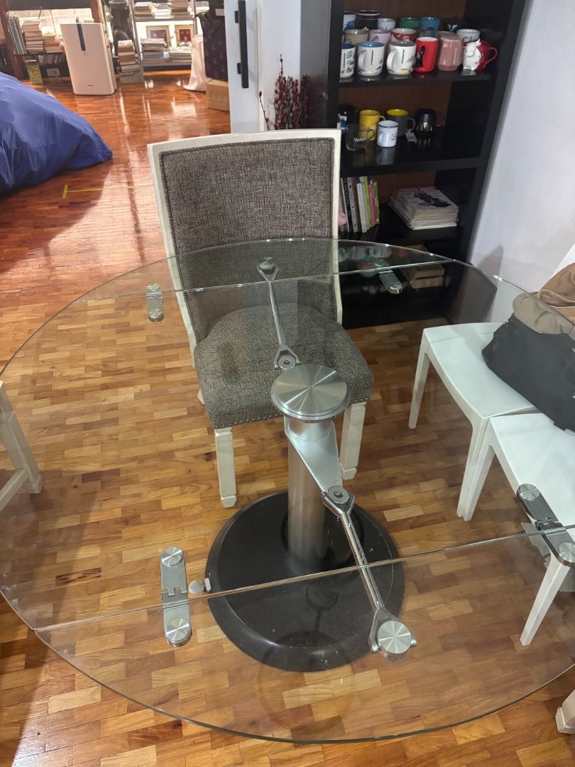 Decor Glass Convertible Table (Category: Tables & Sets) located in Makati City. Submitted by gabdee (Listing ID 1429338589, Image 2). Description: Well-used and cared for glass table About 10 yrs old. Purchased for 60k then. Negotiable Convertible from space-saving rectangular shape to round for more seating capacity Italian technology for the mechanism Very heavy and stable base Can be deconstructed to smaller parts for easier transfer Seats 6 w