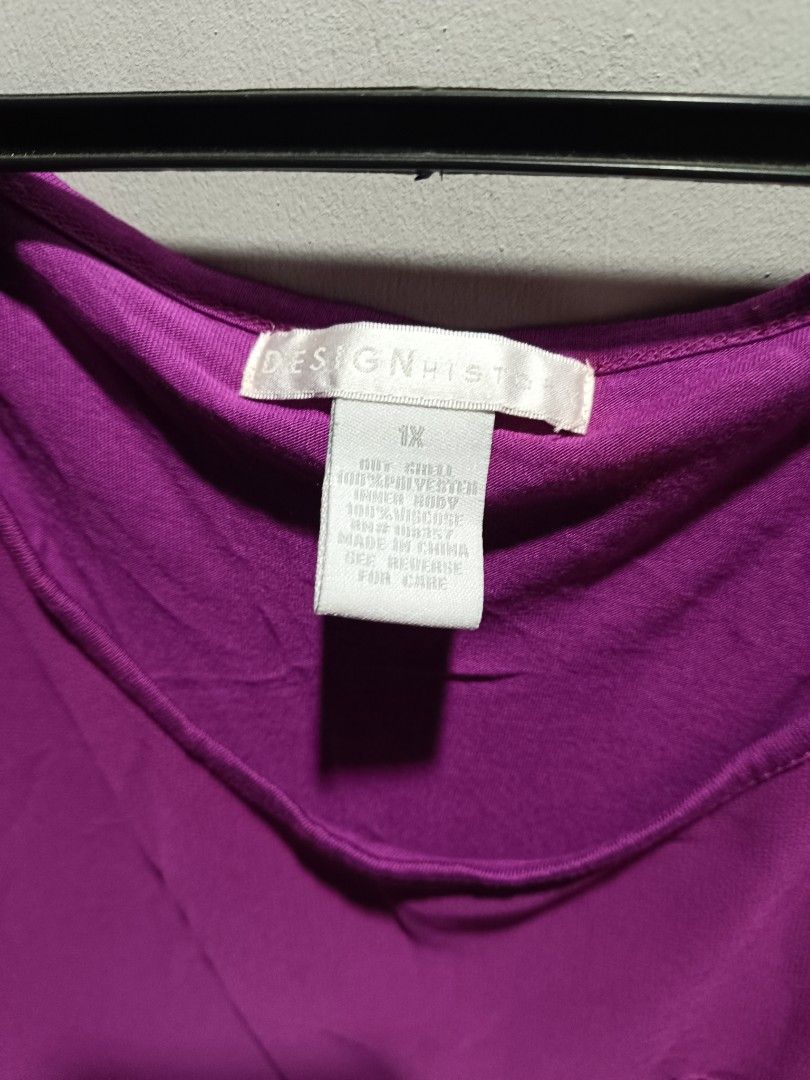 Design History Purple Blouse 1X (Category: Blouses) located in Subic. Submitted by yssacollection (Listing ID 1429494971, Image 3). Description: Purple blouse from Design History. Features a scoop neck, short sleeves, and a single pocket on the chest. The size is 1X. Made of polyester. The blouse is a vibrant purple color. Perfect for casual wear..