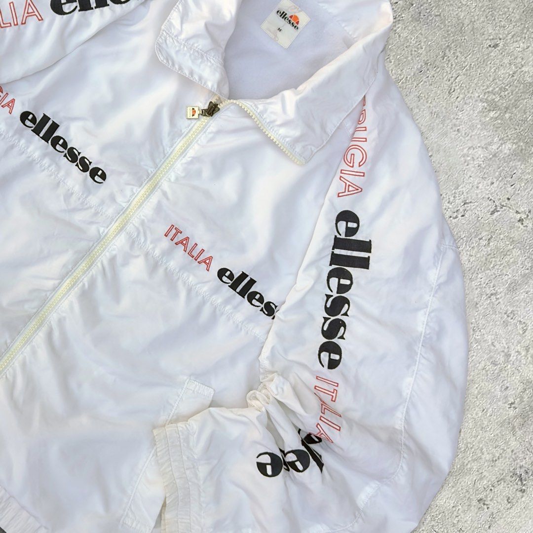 Ellesse Italia White Windbreaker (Category: Coats, Jackets and Outerwear) located in Tacloban City. Submitted by ukaysquaredph (Listing ID 1429442998, Image 3). Description: 📦 Free Shipping 📏 Measurements: • Size: L (boxy fit) • Width: 25” • Length: 25" ✨ Condition: 10/10.