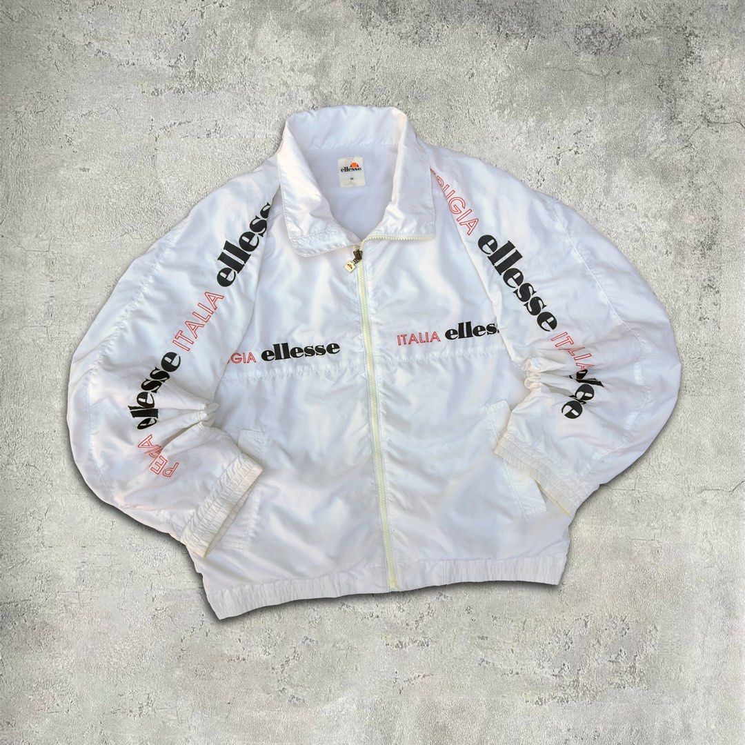 Ellesse Italia White Windbreaker (Category: Coats, Jackets and Outerwear) located in Tacloban City. Submitted by ukaysquaredph (Listing ID 1429442998, Image 1). Description: 📦 Free Shipping 📏 Measurements: • Size: L (boxy fit) • Width: 25” • Length: 25" ✨ Condition: 10/10.