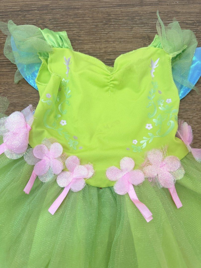 Fairy Costume with Wings (Category: Babies & Kids Fashion) located in Quezon City. Submitted by jnydera (Listing ID 1429373931, Image 2). Description: Fairy costume features a vibrant green bodice and skirt. It is adorned with pink flower accents and matching ribbons. The costume includes attached wings with a touch of blue. Perfect for dress-up or themed parties..