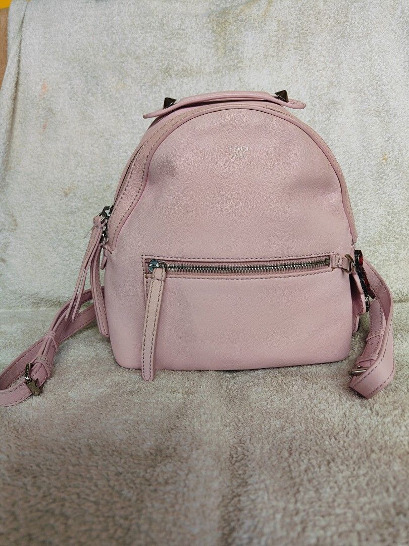 Fendi Pink Leather Backpack (Category: Luxury Bags & Wallets) located in Cebu City. Submitted by cherreymie70208 (Listing ID 1429464018, Image 1). Description: Pink leather backpack by Fendi. Features a top handle, adjustable shoulder straps, and a front zip pocket. The interior is lined with black fabric and includes a Fendi label. Adorned with red jewel embellishments on the side. The zipper has the Fendi logo. Made in Italy..