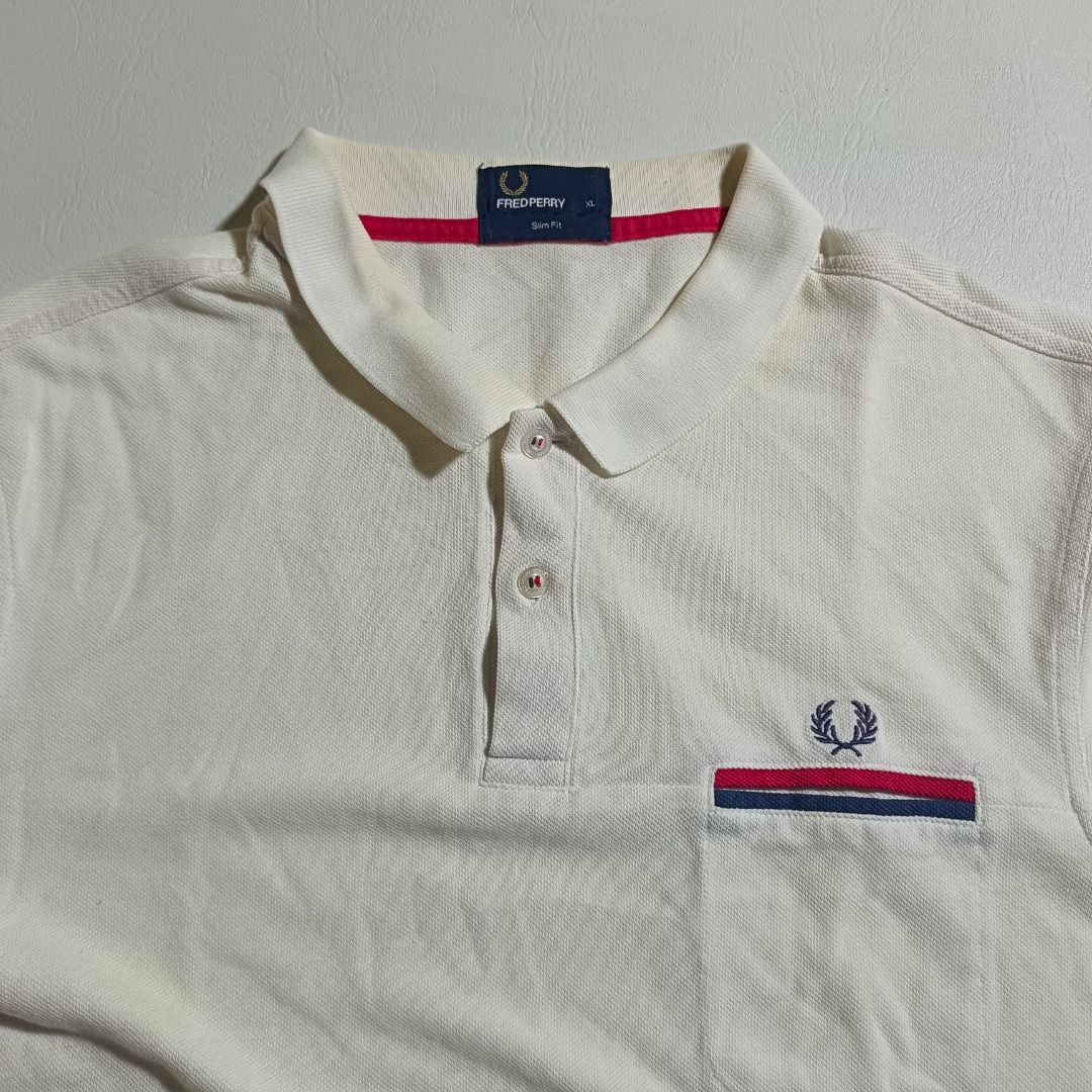 Fred Perry Poloshirt (Category: Activewear) located in Baguio. Submitted by freshmarket_2600 (Listing ID 1429473092, Image 2). Description: MINE 250 Brand: Fred Perry Tags: Complete Size: Large Dimension: L27.5W20.5 Condition: Excellent Color rate: 10/10 Color: White Issue/s: None.