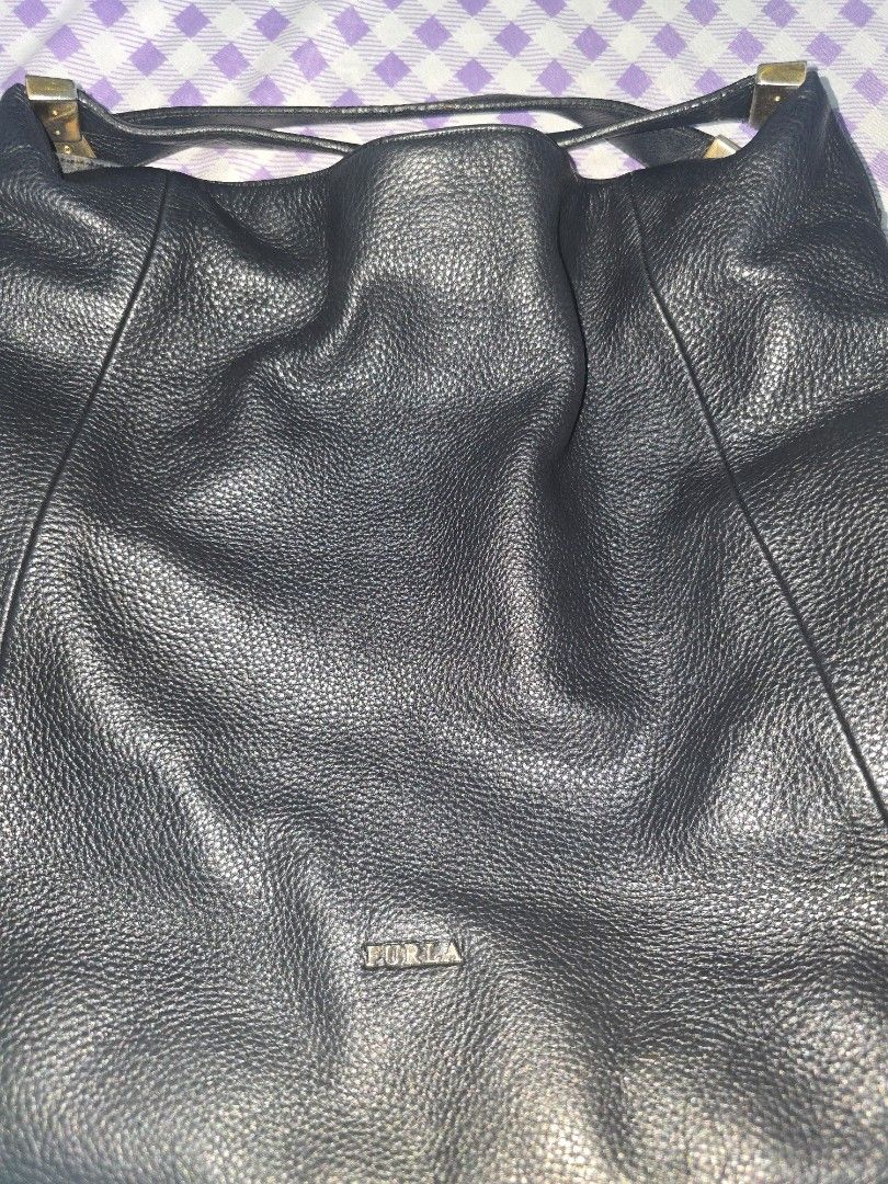 Furla Black Leather Shoulder Bag (Category: Luxury Bags & Wallets) located in Caloocan City. Submitted by phyllis4 (Listing ID 1429441555, Image 3). Description: in good condition yes its used.