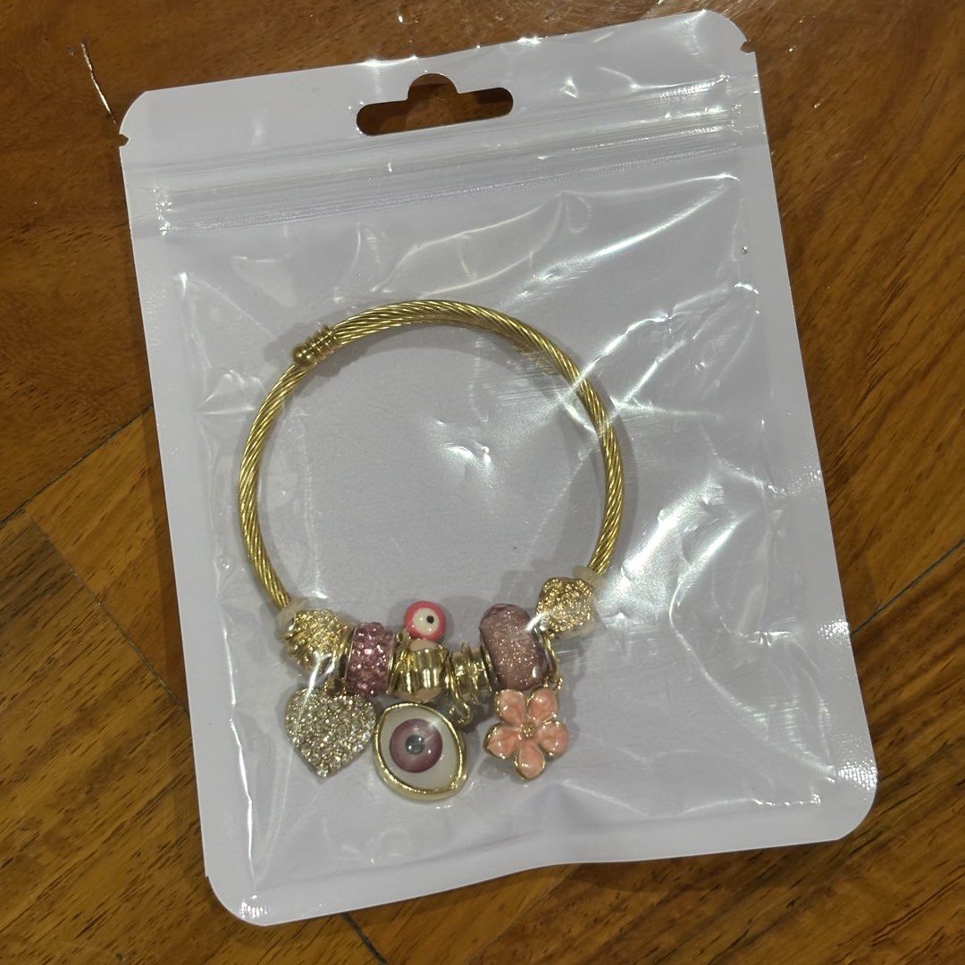 Gold Charm Bracelet + Silver Diamond Pendant (Category: Bracelets) located in Quezon City. Submitted by closetpg (Listing ID 1429472315, Image 2). Description: Buy 2 for ₱200 Each priced at ₱100 .