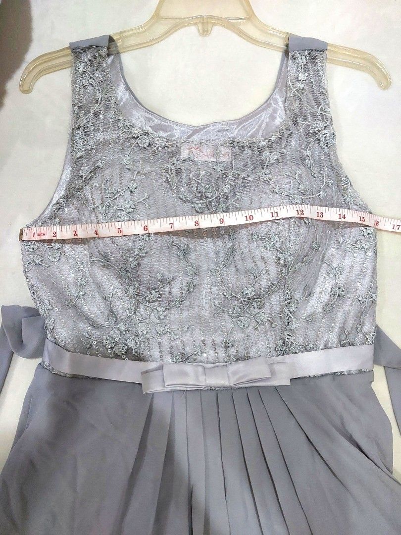 Gray Embellished Formal Gown (Category: Evening dresses & gowns) located in San Juan City. Submitted by chompchinks (Listing ID 1429495432, Image 1). Description: Chest - 16 inch Height- 54 inch Can fit small to medium. Can be tied at the back. Never worn before. Garterized waist with ribbon. Bodice is padded. The gown is floor length without heels if you are 5'1½ Delivery fee to be shouldered by the buyer. DM for inquiry :)).