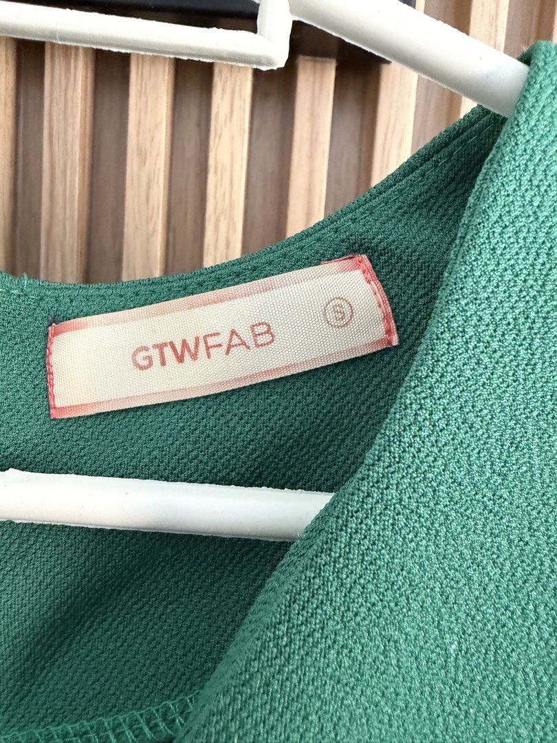 GTWFAB Green Wrap Dress - Size S (Category: Dresses) located in Las Pinas. Submitted by nothingover300 (Listing ID 1429398356, Image 2). Description: GTWFAB dress features a flattering wrap design in a vibrant green color. It includes a matching belt to cinch the waist. The dress has short sleeves and a V-neckline. The size is small (S)..