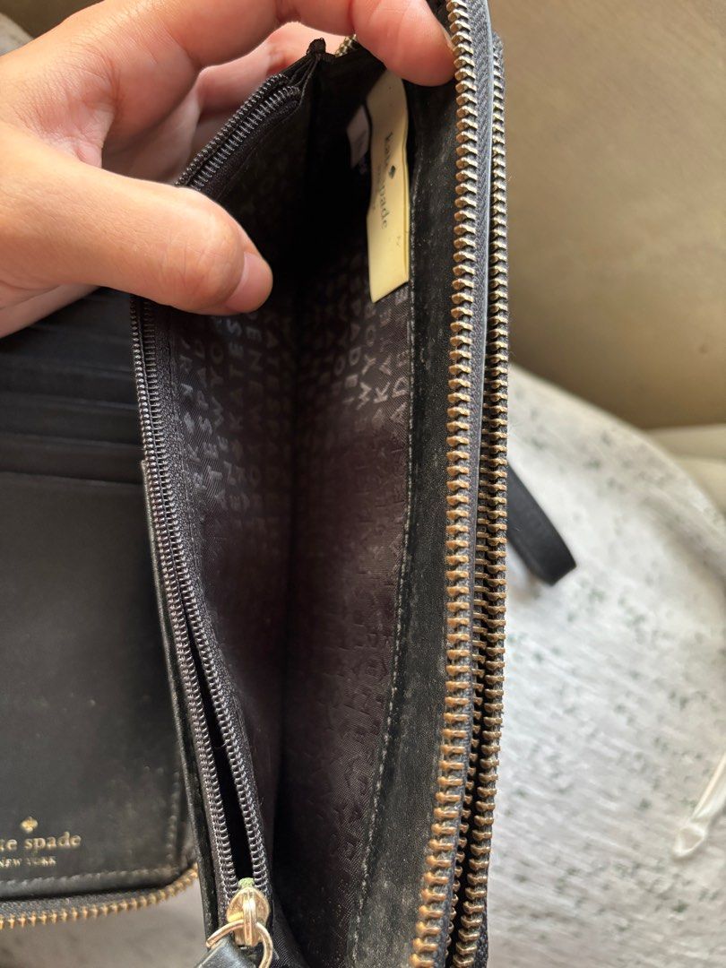 Kate Spade Black Zip Around Wallet (Category: Luxury Bags & Wallets) located in Tarlac. Submitted by vectorreyes (Listing ID 1429427422, Image 3). Description: •lots of card slots •lots of bill slot •zipper all working •authentic from canada •can fit iphone Issue: inside rubbing.