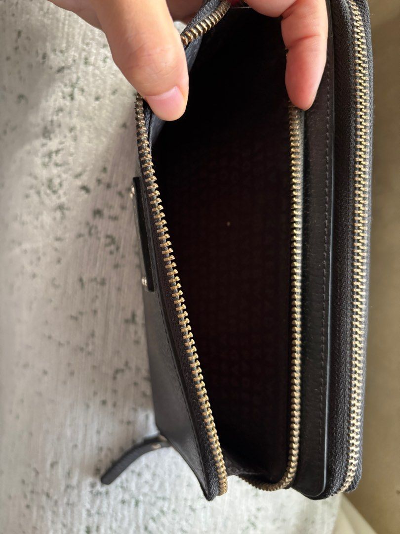 Kate Spade Black Zip Around Wallet (Category: Luxury Bags & Wallets) located in Tarlac. Submitted by vectorreyes (Listing ID 1429427422, Image 2). Description: •lots of card slots •lots of bill slot •zipper all working •authentic from canada •can fit iphone Issue: inside rubbing.