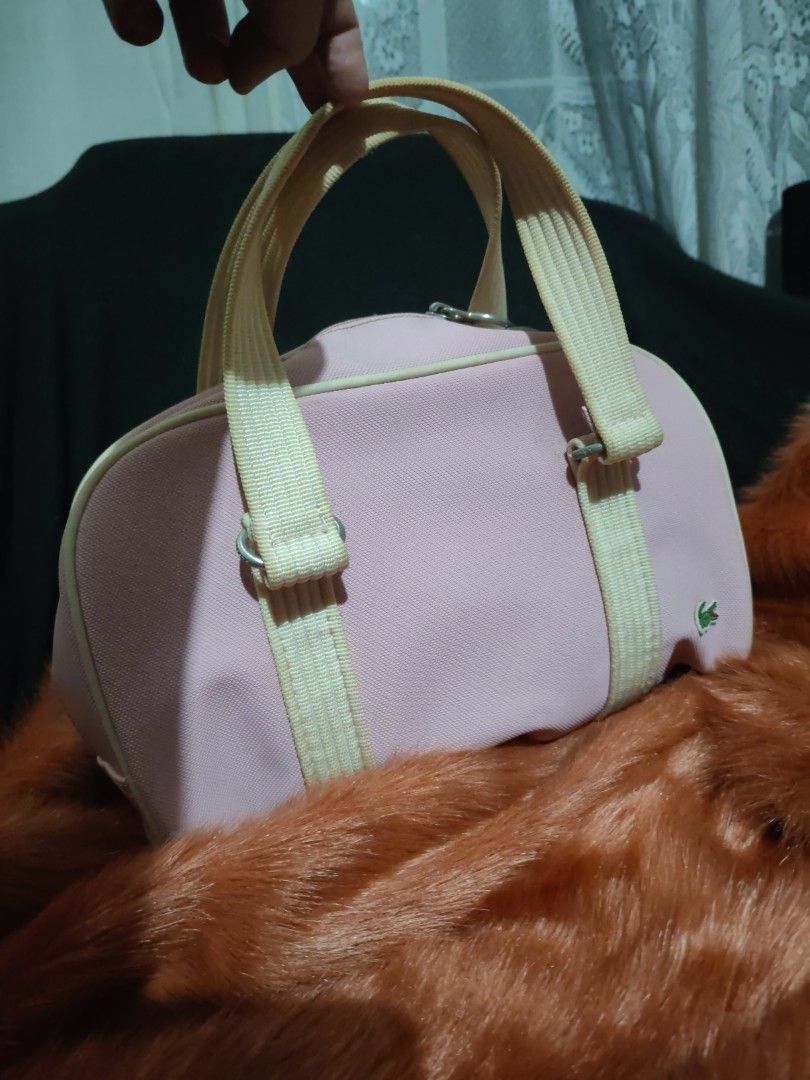 Lacoste New Classic 26 Handbag (Category: Luxury Bags & Wallets) located in Paranaque City. Submitted by princessitems (Listing ID 1429473267, Image 2). Description: Authentic Lacoste handbag. Features a striped green and white interior lining. The model is New Classic 26, and the color is Candy Floss. The bag has a Lacoste logo inside. The bag's style is a classic design, perfect for everyday use..