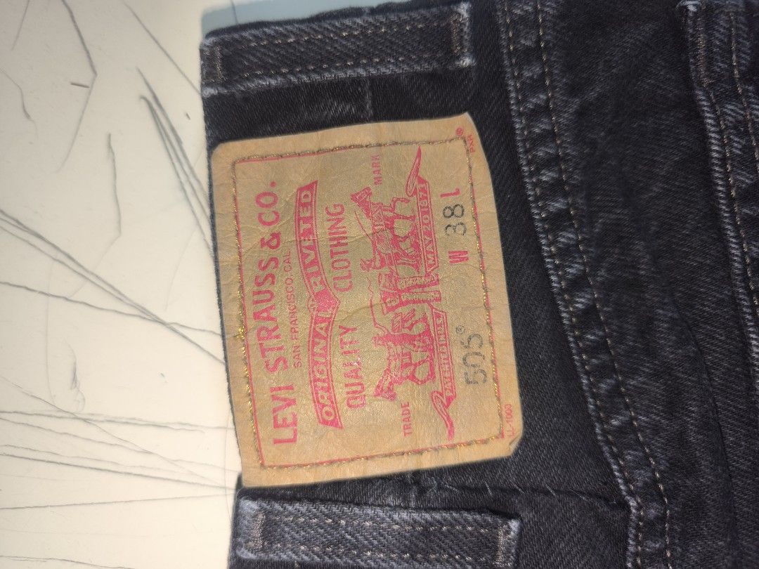 Levi's 505 Regular Fit Denim Shorts (Category: Shorts) located in Manila. Submitted by sixthstreetsupply (Listing ID 1429471792, Image 3). Description: Classic Levi's 505 regular fit denim shorts in black. Features the iconic Levi's red tab and back pocket stitching. The shorts have a button closure and classic five-pocket design. The size is 38. Made in Mexico. The shorts are a versatile addition to any wardrobe..