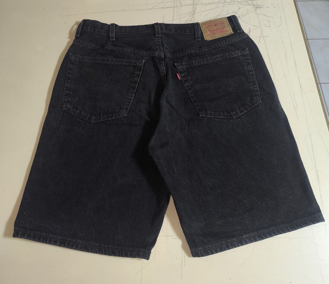 Levi's 505 Regular Fit Denim Shorts (Category: Shorts) located in Manila. Submitted by sixthstreetsupply (Listing ID 1429471792, Image 2). Description: Classic Levi's 505 regular fit denim shorts in black. Features the iconic Levi's red tab and back pocket stitching. The shorts have a button closure and classic five-pocket design. The size is 38. Made in Mexico. The shorts are a versatile addition to any wardrobe..