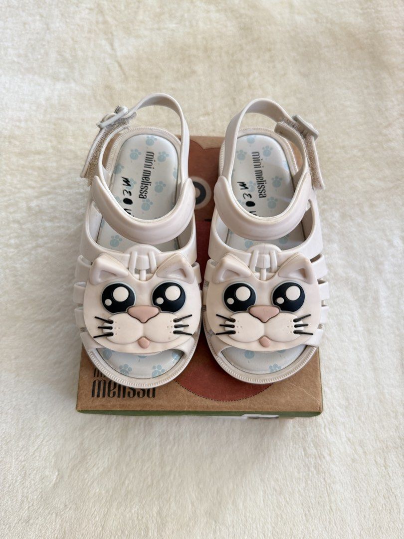 Mini Melissa Cat Sandals Size 9 (Category: Babies & Kids Fashion) located in Tuguegarao City. Submitted by declutteringmommaaa (Listing ID 1417956672, Image 1). Description: - Mini Melissa sandals first owner - Cute cat design - Light beige color - Buckle closure for secure fit - Comes with original box - Perfect for kids!.