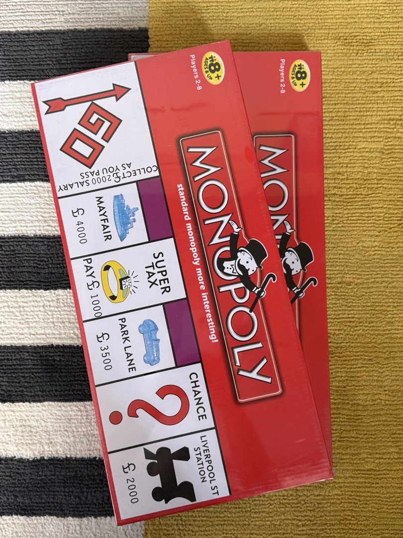 Monopoly Board Game (Category: Board Games & Puzzles) located in Quezon City. Submitted by playboxph (Listing ID 1429417630, Image 1). Description: Classic Monopoly board game. For 2-8 players, ages 8 and up. Features the standard Monopoly gameplay with properties, Chance cards, and the goal of bankrupting your opponents. Includes the game board, tokens, houses, hotels, dice, and money. Get ready to buy, sell, and trade your way to victory!.