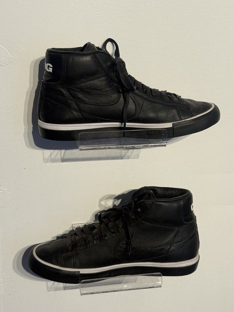 Nike CDG Black High-Top Sneakers (Category: Sneakers) located in Digos. Submitted by TD.Thrift (Listing ID 1429369782, Image 2). Description: Black high-top sneakers featuring the Nike swoosh and CDG branding on the heel. The sneakers have a white midsole and black outsole. The insole has the "BLACK COMME des GARCONS" and Nike logo. The size is US 6, UK 5.5 EUR 38.5, and 24 cm..