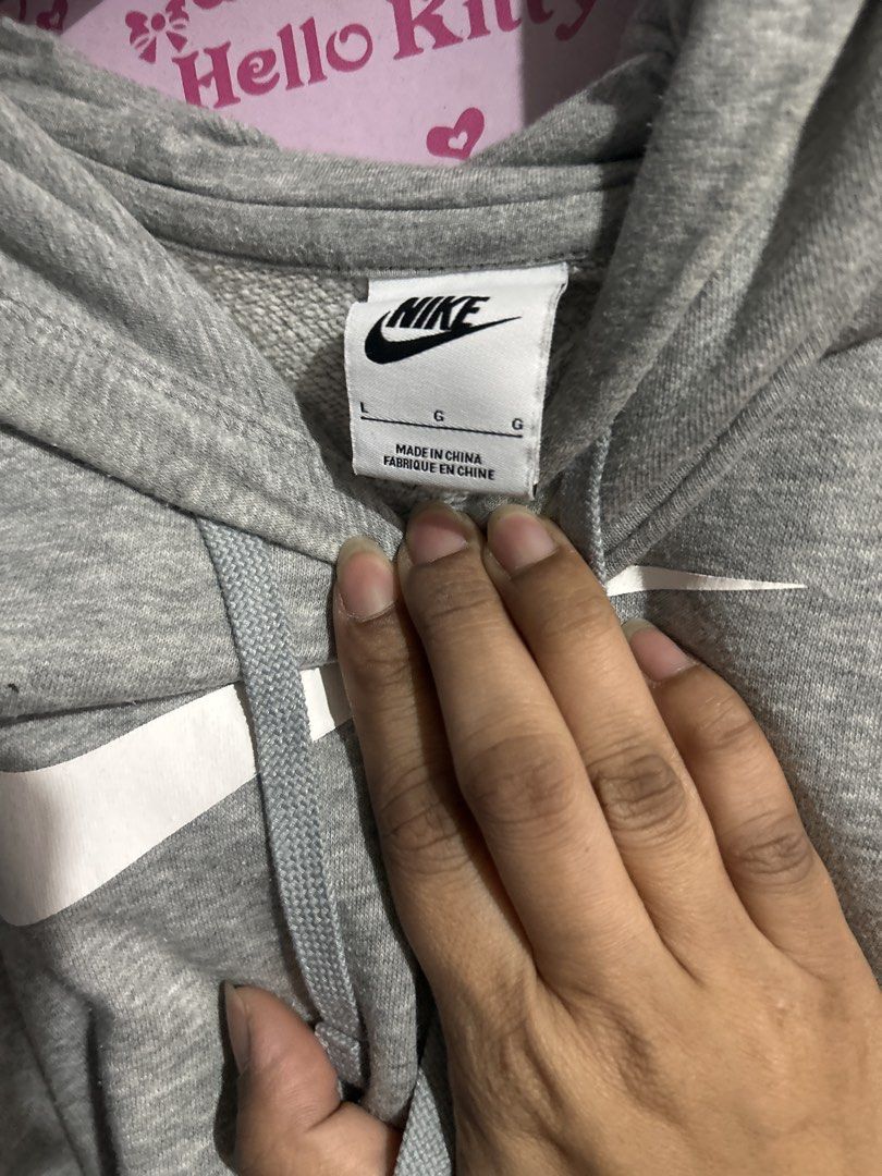 Nike Gray Hoodie (Category: Coats, Jackets and Outerwear) located in Manila. Submitted by hellokitty_21 (Listing ID 1429453955, Image 2). Description: Nike sweater, large, original .