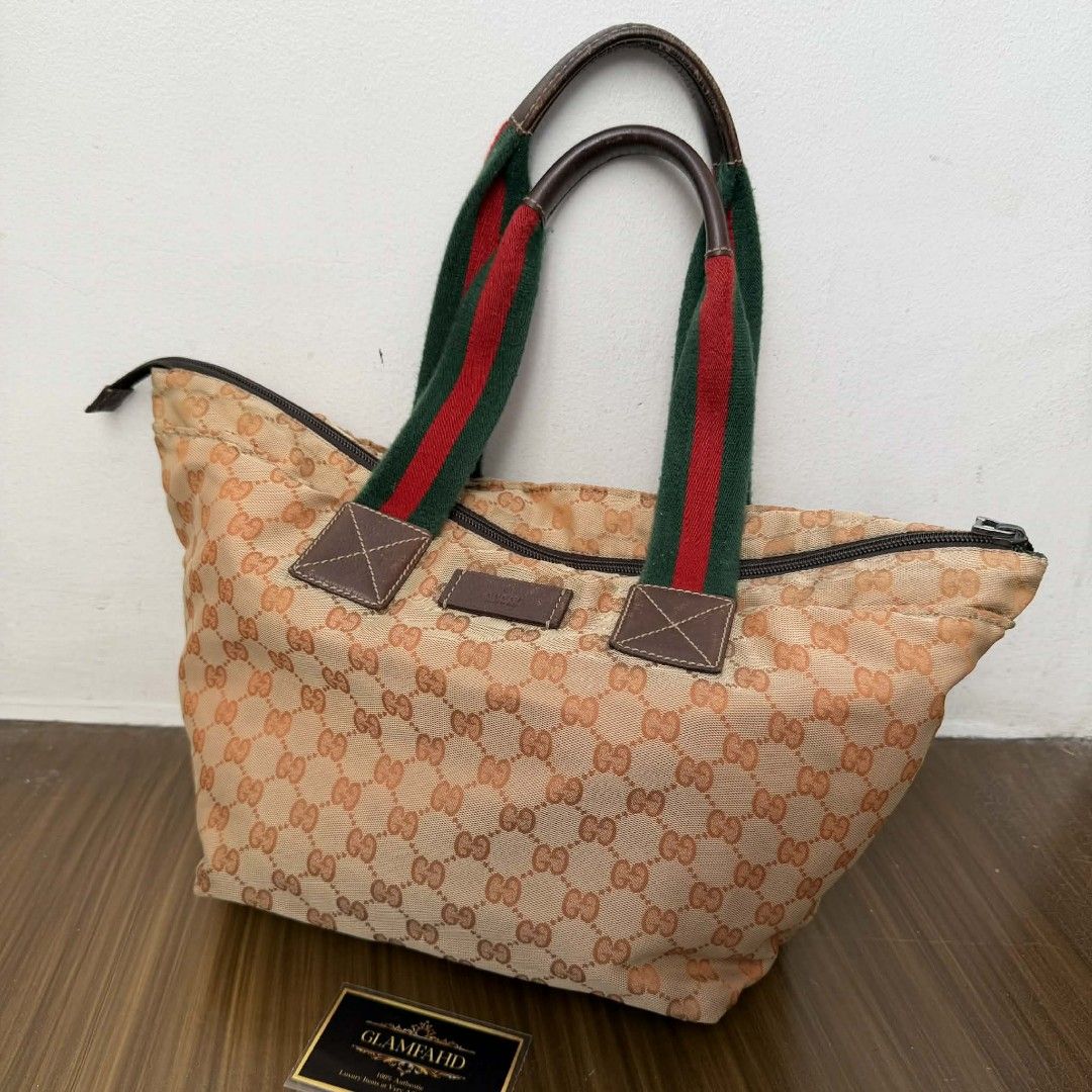 Pre Owned Authentic GUCCI GG Canvas Sherryline Bag (Category: Luxury Bags & Wallets) located in Paranaque City. Submitted by Glamfahd (Listing ID 1429348765, Image 2). Description: Pre Owned Authentic GUCCI GG Bag Inclusion/s: None Condition Well Used condition Marks on exterior Marks on interior Missing zipper puller Bag is really a great buy! Please manage your expectations as you are buying an authentic second hand item at a fraction of the co