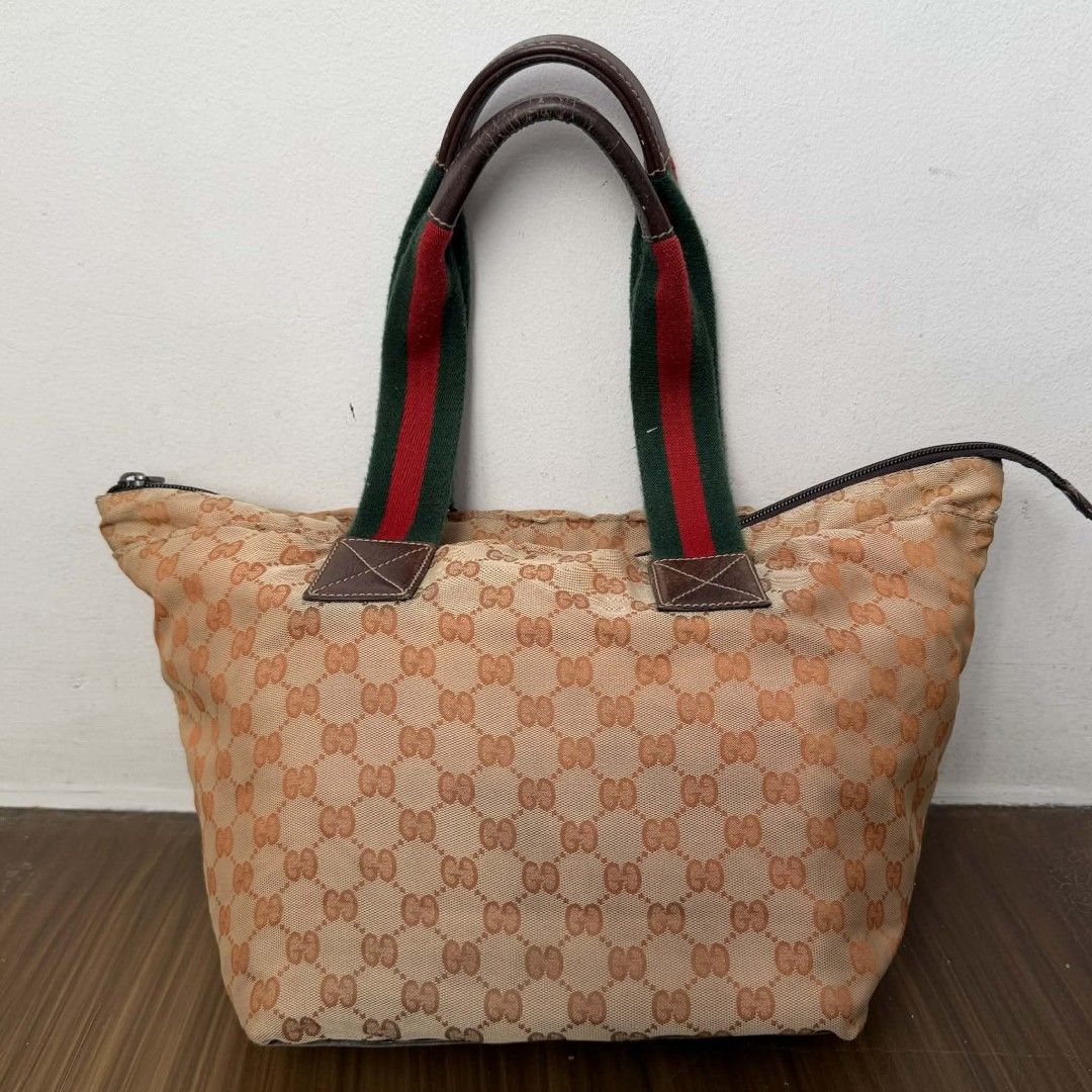 Pre Owned Authentic GUCCI GG Canvas Sherryline Bag (Category: Luxury Bags & Wallets) located in Paranaque City. Submitted by Glamfahd (Listing ID 1429348765, Image 3). Description: Pre Owned Authentic GUCCI GG Bag Inclusion/s: None Condition Well Used condition Marks on exterior Marks on interior Missing zipper puller Bag is really a great buy! Please manage your expectations as you are buying an authentic second hand item at a fraction of the co